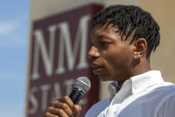 With a tear running down his face, former New Mexico State NCAA college basketball player Deuce Benjamin speaks at a news conference in Las Cruces, N.M., Wednesday, May 3, 2023. Benjamin and former Aggie player Shak Odunewu discussed the lawsuit they filed alleging teammates ganged up and sexually assaulted them multiple times, while their coaches and others at the school didn't act when confronted with the allegations. (AP Photo/Andres Leighton)