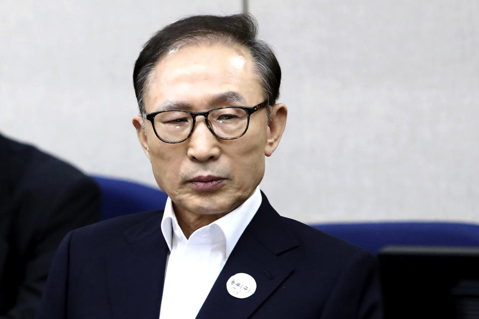 FILE - In this March 23, 2018, file photo, former South Korean President Lee Myung-bak appears for his first trial at the Seoul Central District Court in Seoul, South Korea. Lee was sent back to prison on Monday, Nov. 2, 2020, four days after the country’s top court upheld a 17-year prison term on him over corruption crimes. (Chung Sung-Jun/Pool Photo via AP, File)