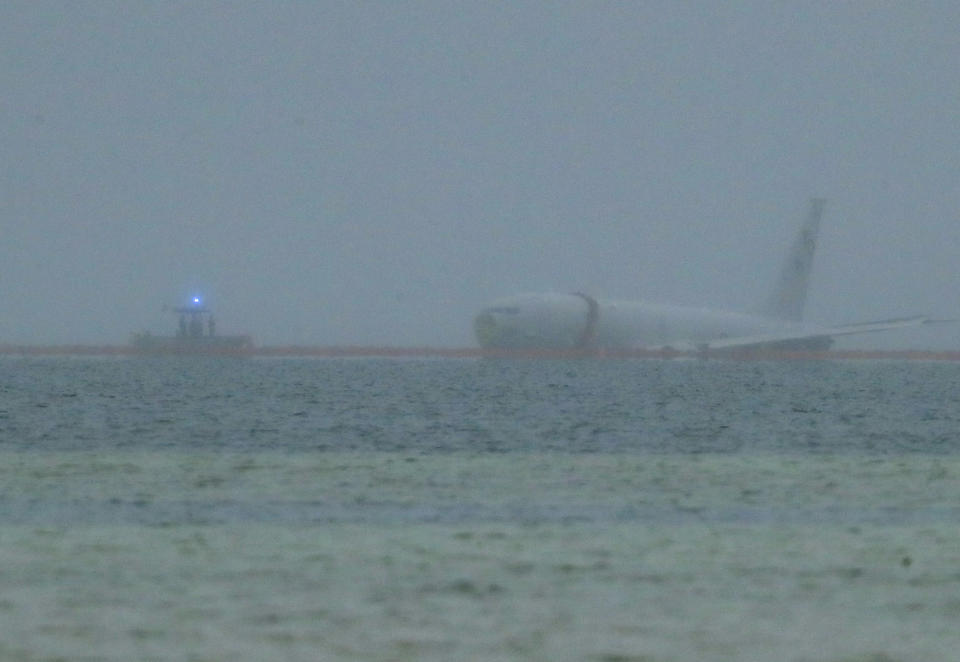 FILE - A downed U.S. Navy aircraft is seen in Kaneohe Bay, Monday, Nov. 20, 2023, in Kaneohe, Hawaii. The flight data recorder of a large U.S. Navy plane that overshot a runway and landed in the water near Honolulu has been recovered as the military continues to plan for the aircraft’s removal. (Jamm Aquino/Honolulu Star-Advertiser via AP, File)