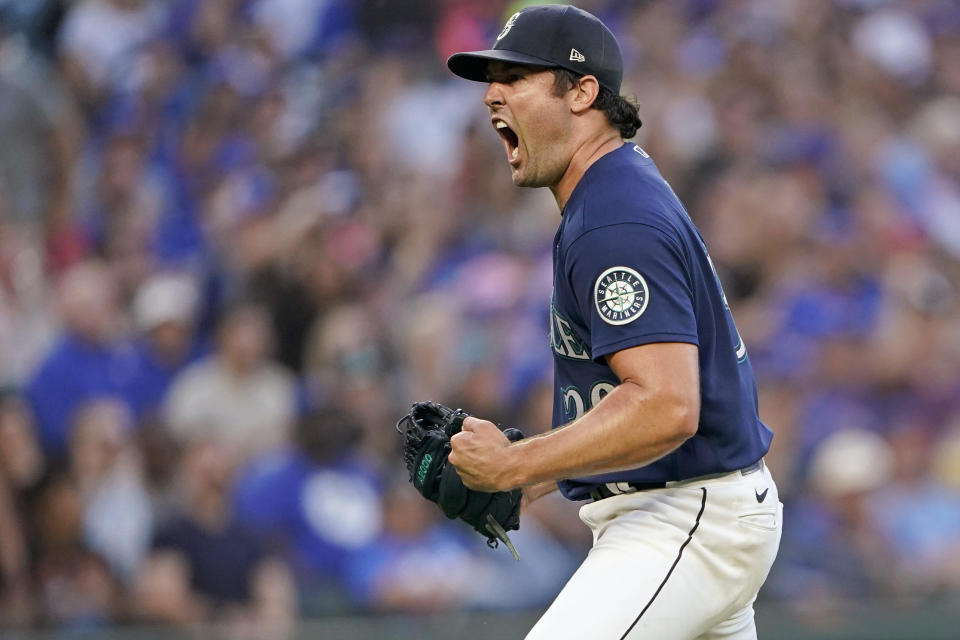 Seattle Mariners starting pitcher Robbie Ray reacts after getting out of a based-loaded jam at the end of the top of the fifth inning of a baseball game against the Toronto Blue Jays, Saturday, July 9, 2022, in Seattle. (AP Photo/Ted S. Warren)