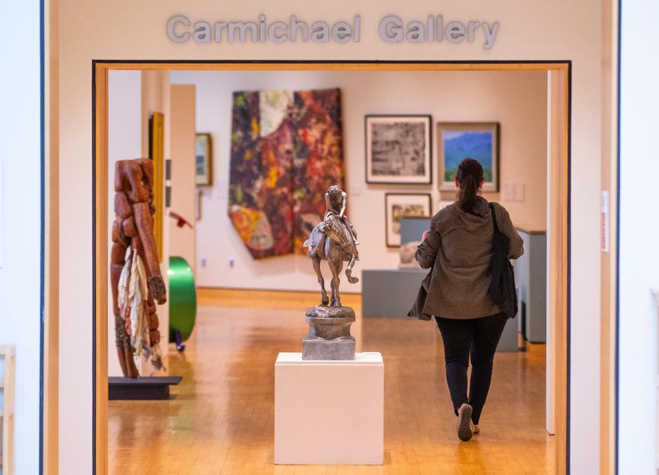 A visitor walks through the new permanent at the South Bend Museum of Art that traces its 75-year history on May 25, 2022.