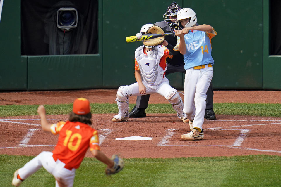 El Segundo, Calif.'s Brody Brooks (14) hits a solo home run off Needville, Texas' DJ Jablonski (10) in the first inning of the United States Championship baseball game at the Little League World Series tournament in South Williamsport, Pa., Saturday, Aug. 26, 2023. (AP Photo/Tom E. Puskar)