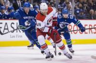 Jan 23, 2019; Vancouver, British Columbia, CAN; Vancouver Canucks forward Brock Boeser (6) chases Carolina Hurricanes defenseman Dougie Hamilton (19) in the second period at Rogers Arena. Mandatory Credit: Bob Frid-USA TODAY Sports