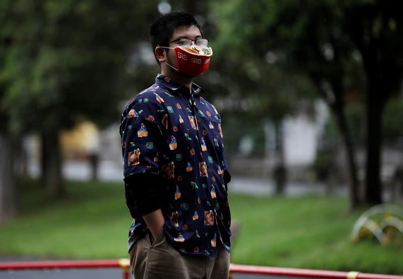 Japanese designer Takahiro Shibata's poses for a photo at a park in Yokohama