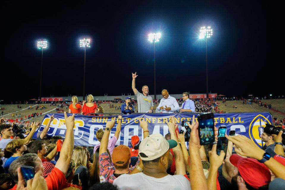 New Florida coach Billy Napier celebrates a Sun Belt Conference championship after his final game as coach of the Ragin' Cajuns. UL beat App State 24-16 Saturday and is headed to the New Orleans Bowl without Napier.