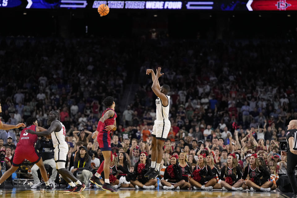 San Diego State guard Lamont Butler scores the game winning basket against Florida Atlantic in a Final Four college basketball game in the NCAA Tournament on Saturday, April 1, 2023, in Houston. (AP Photo/Brynn Anderson)