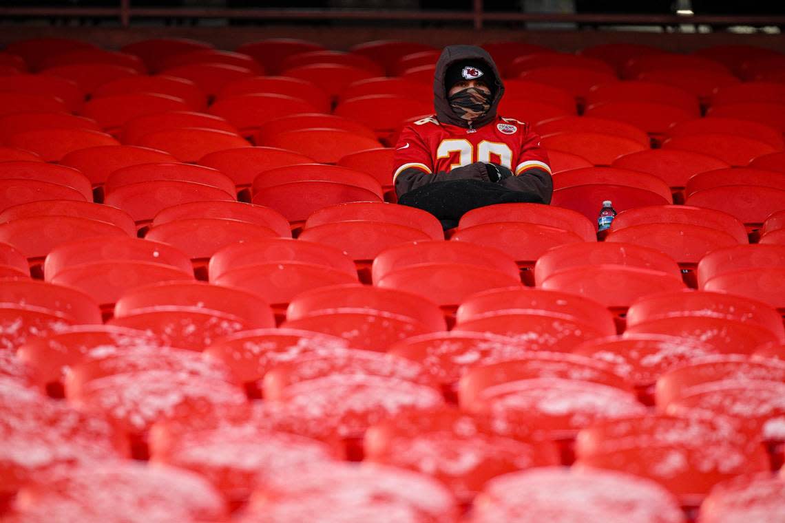 A Kansas City Chiefs fan sits in the fans and waits for the AFC Wild Card game with the Miami Dolphins to start Saturday, Jan. 13, 2024, at GEHA Field at Arrowhead Stadium.