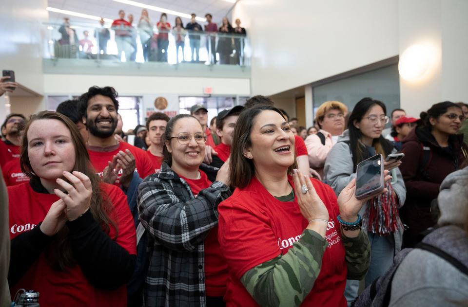 Ohio State professor emeritus Pierre Agostini, the second-ever faculty Nobel Prize winner, is welcomed by students and staff Wednesday as he enters the Ohio State University Physics Research Building for a homecoming visit.