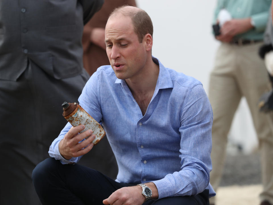 The Duke of Cambridge picks up rubbish washed up on the beach during his visit to Kuwait City's wetlands at the Jahra Nature Reserve to learn more about Kuwait's ambitious plans to protect its natural environment from human and environmental challenges. as part of his tour of Kuwait and Oman. PA Photo. Picture date: Monday December 2, 2019. See PA story ROYAL Tour. Photo credit should read: Andrew Matthews/PA Wire