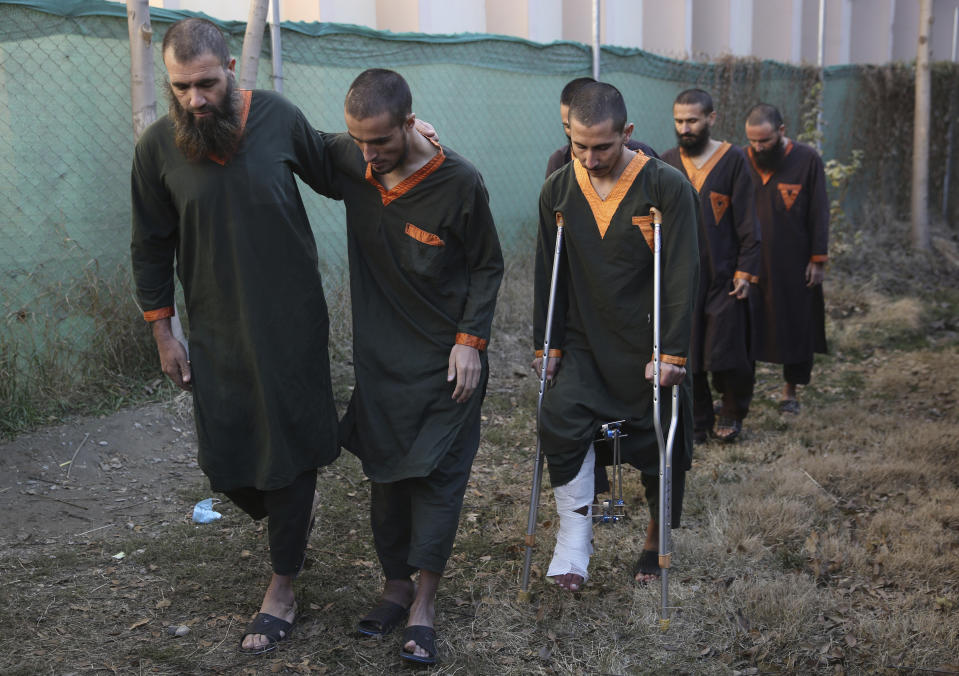 Islamic State militants either arrested or surrounded up to the Afghan government are presented to media in Kabul, Afghanistan, Saturday, Dec. 21, 2019. The country's intelligence service says Saturday that there are more than 75 women and 159 children most of them form foreign countries in the custody of the agency known as the National Deteriorate for Security. (AP Photo/Rahmat Gul)