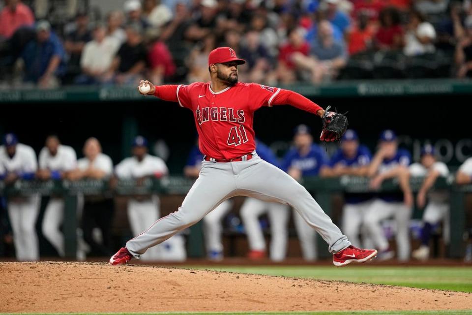 Los Angeles Angels relief pitcher Reynaldo Lopez throws to the Texas Rangers during a baseball game, Wednesday, Aug. 16, 2023, in Arlington, Texas. (AP Photo/Tony Gutierrez)
