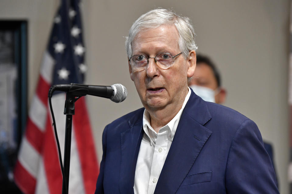 Senate Majority Leader Mitch McConnell, R-Ky., speaks with reporters during a visit to the Boundary Oak Distillery in Radcliff, Ky., Wednesday, Aug. 19, 2020. (AP Photo/Timothy D. Easley)