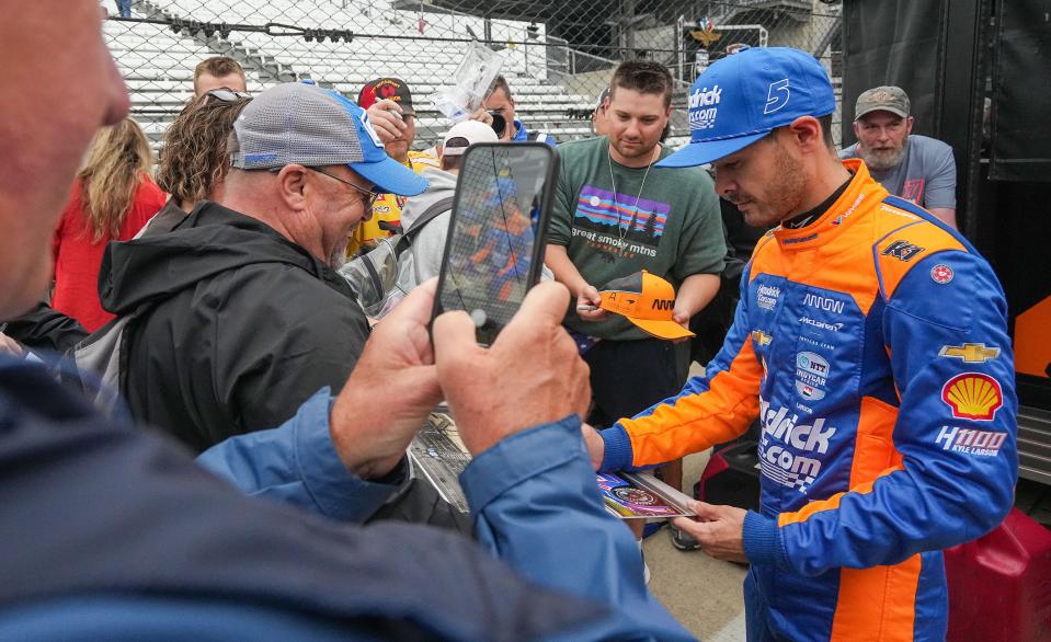Arrow McLaren/Rick Hendrick driver Kyle Larson (17) signs autographs for fans on Tuesday, May 14, 2024, during the first day of practice ahead of the 108th running of the Indianapolis 500 at Indianapolis Motor Speedway.