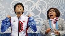 Japan's Yuzuru Hanyu reacts in the "kiss and cry" area during the Figure Skating Men's Short Program at the Sochi 2014 Winter Olympics, in this February 13, 2014 file photo. REUTERS/Lucy Nicholson/Files (RUSSIA - Tags: TPX IMAGES OF THE DAY SPORT OLYMPICS FIGURE SKATING)