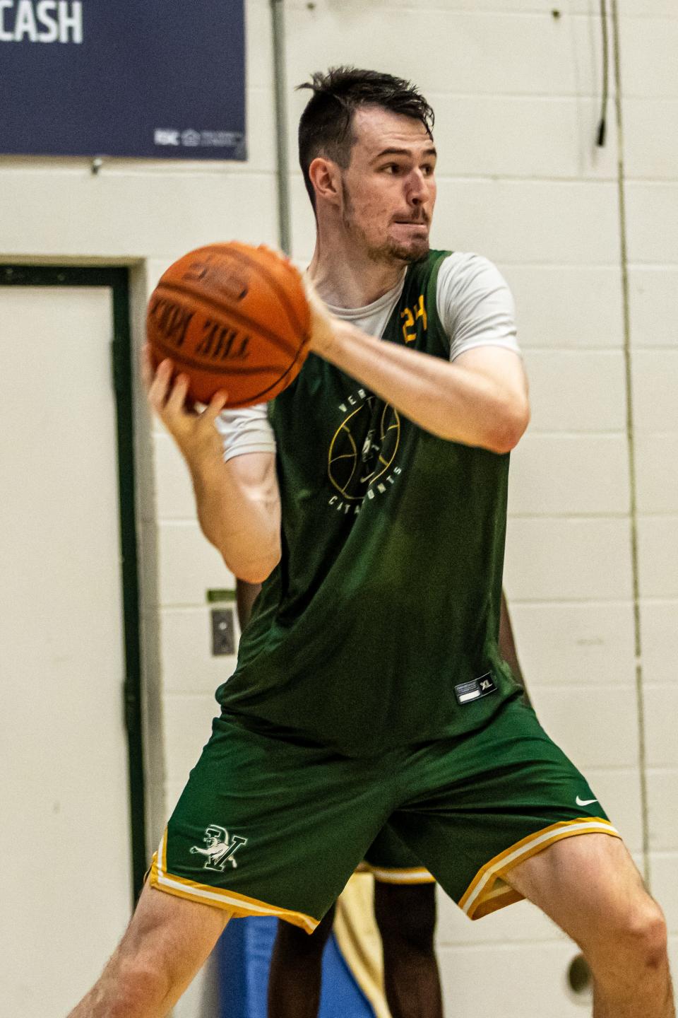 Senior Matt Veretto makes a move during a UVM men's basketball summer practice earlier this month at Patrick Gym.