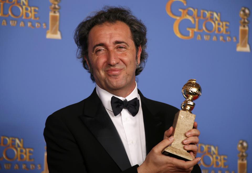 Producer Nicola Giuliano poses backstage with the award for Best Foreign Language Film for "The Great Beauty" at the 71st annual Golden Globe Awards in Beverly Hills