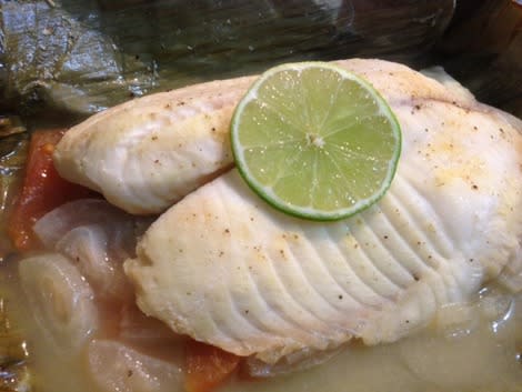 Tilapia cooked in plantain leaf 