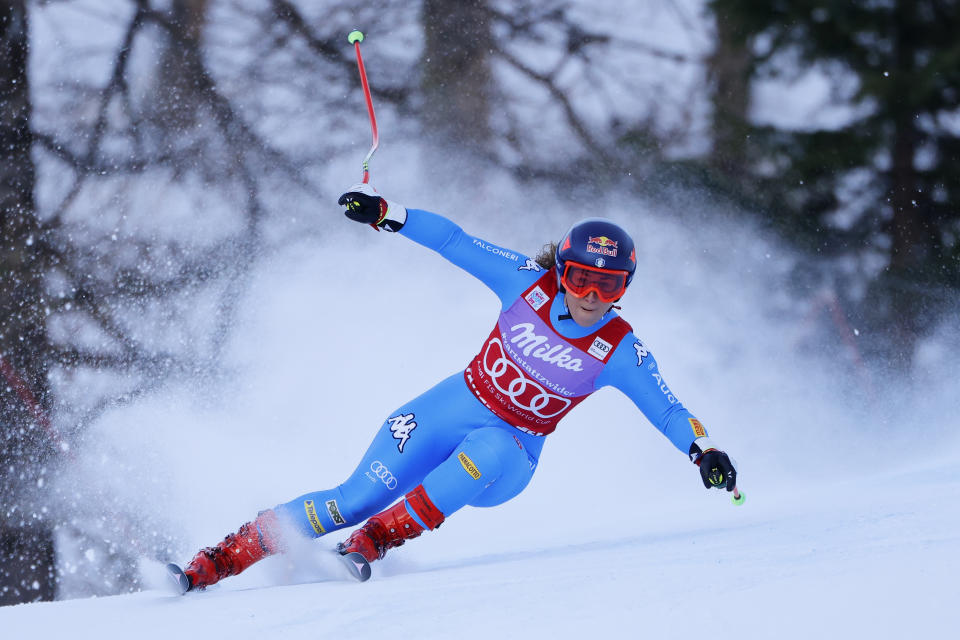 Italy's Sofia Goggia speeds down the course during an alpine ski, women's World Cup super-G race in Zauchensee, Austria, Sunday, Jan. 16, 2022. (AP Photo/Giovanni Maria Pizzato)