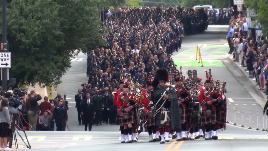 Bagpipes led the processional from CMPD headquarters to First Baptist Church Charlotte.