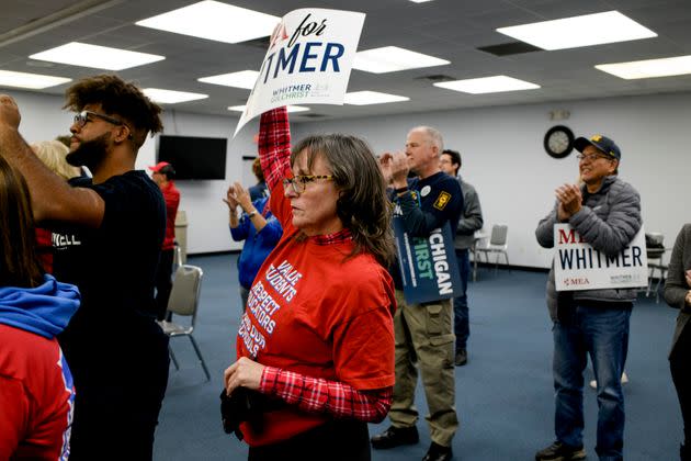 Liza Parkinson, an organizer with the Michigan Education Association, holds a sign in support of Whitmer during a campaign event at the UAW Local 3000 offices on Oct. 26. (Photo: Brittany Greeson for HuffPost)