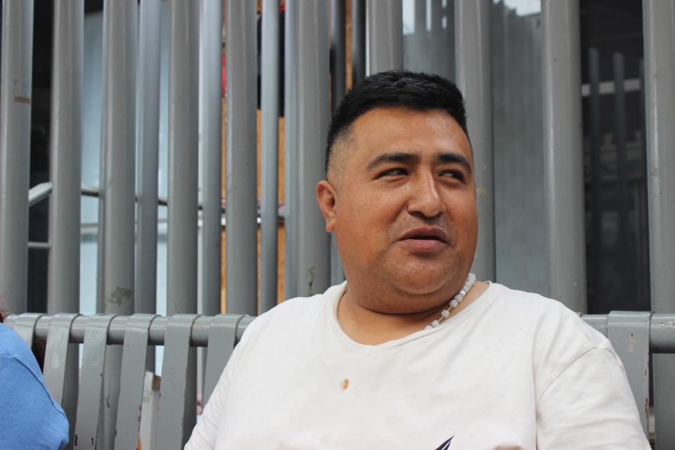 Fernando Perez, an asylum seeker from Guerrero, Mexico, sits outside of the Dennis DeConcini Port of Entry in Nogales, Sonora, on Wednesday, May 17, 2023. Perez has been waiting at the port for three days in order to request asylum without a CBP One appointment.
