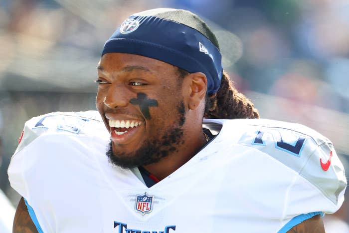 Helmetless Derrick Henry in white Titans jersey