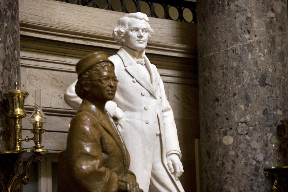 A sculpture of John Gorrie of Florida, inventor of the ice machine, stands next to the popular Rosa Parks in Statuary Hall at the Capitol in Washington, Tuesday, July 2, 2013. A physician, scientist, and inventor, Gorrie is considered the father of refrigeration and air-conditioning; he died impoverished and virtually forgotten in 1855. Among the U.S. Capitol’s many statues which honor the nation’s founders, leaders and legends, the marble figure by scuptor C.A. Pillars, is largely overlooked by thousands of visitors who tour the Capitol daily. (AP Photo/J. Scott Applewhite)