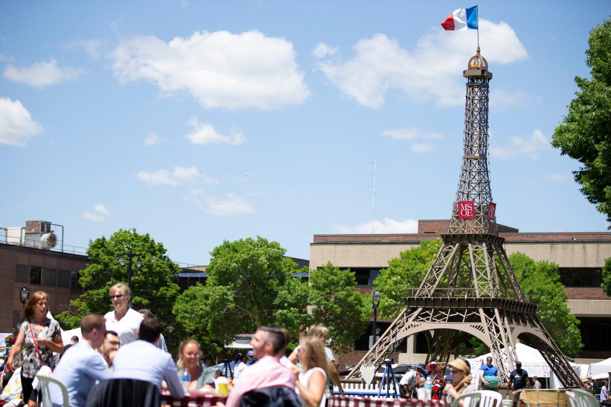 A model of the Eiffel Tower stands in Cathedral Square Park during Bastille Days in Milwaukee's East Town neighborhood in 2019. The free street festival is returning in 2022, but minus the tower.