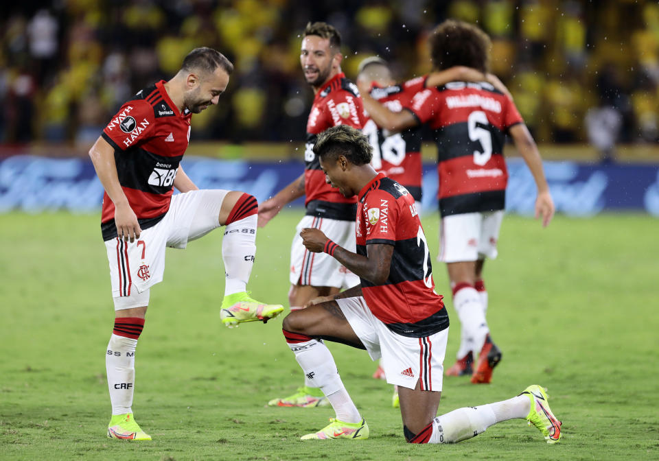 Bruno Henrique of Brazil's Flamengo, right, celebrates with Everton Ribeiro of Brazil's Flamengo after scoring his side's second goal against Ecuador's Barcelona during a Copa Libertadores semifinal second leg soccer match at Monumental stadium in Guayaquil, Ecuador, Wednesday, Sept. 29, 2021. (Franklin Jacome/Pool via AP)