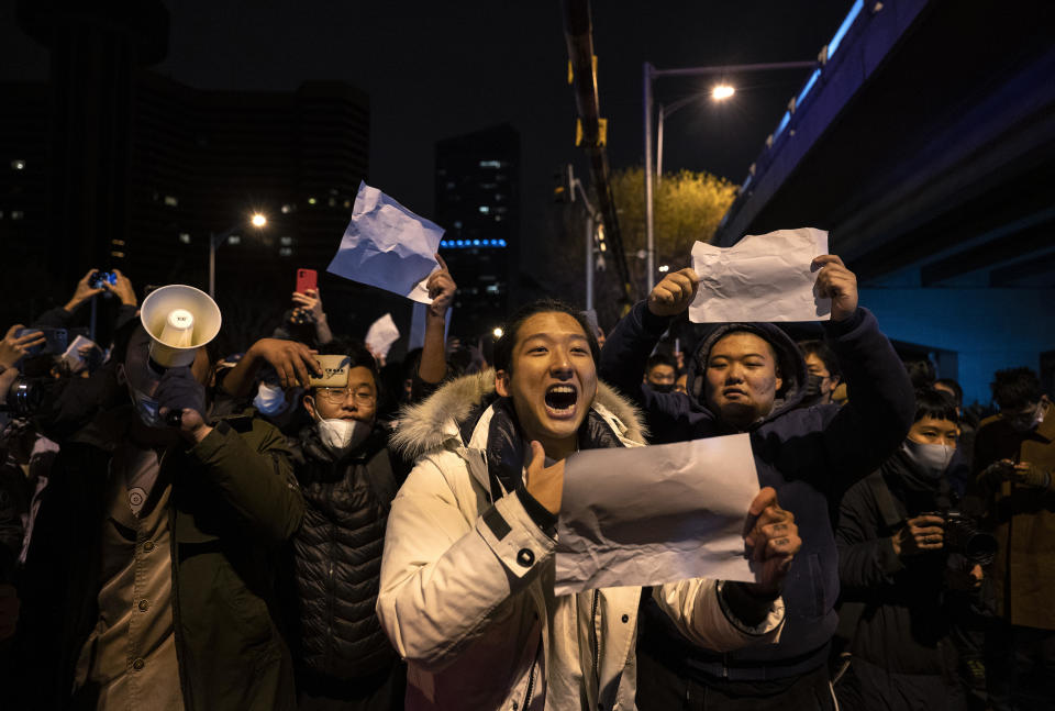 A protester shouts slogans against China's strict zero COVID measures on November 28, 2022 in Beijing, China. / Credit: Kevin Frayer/Getty Images