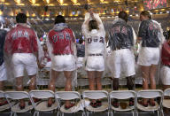 <p>U.S. athletes stand on chairs in the rain during the closing ceremony for the 2016 Rio Olympics. (REUTERS/Stoyan Nenov) </p>