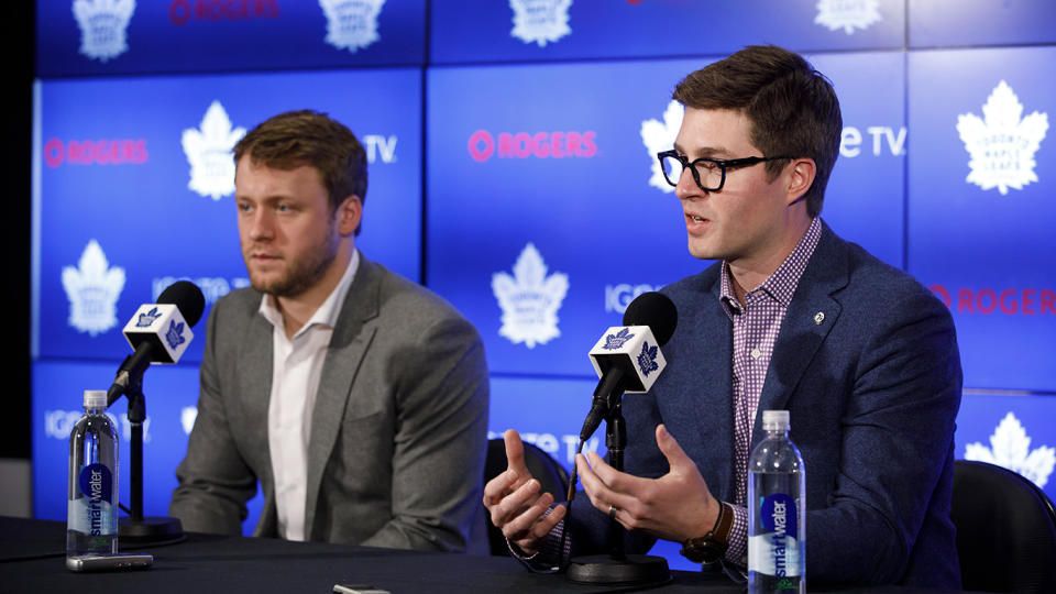 Toronto Maple Leafs defenceman Morgan Rielly, left, looks on alongside General Manager Kyle Dubas as they address an NHL investigation into an alleged slur during last night's game against the Tampa Bay Lightning, in Toronto, Tuesday, March 12, 2019. THE CANADIAN PRESS/Cole Burston