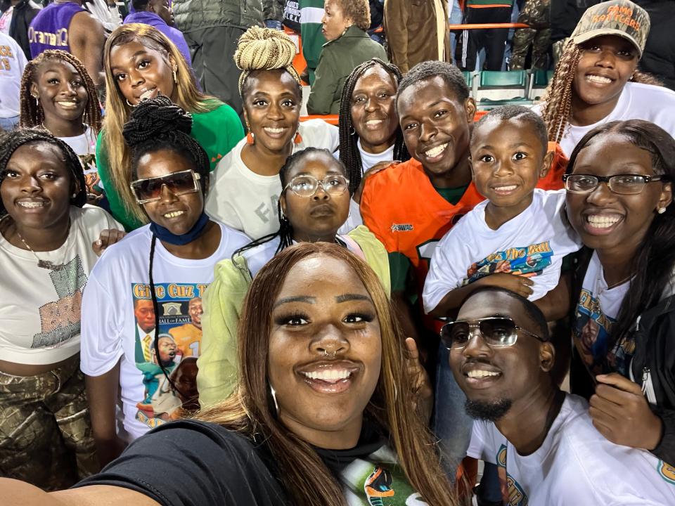 Florida A&M University receiver Xavier Smith (orange jersey) and brother Kareem Smith (bottom right) poses for a group photo during the Rattlers’ 2022 homecoming game against Arkansas-Pine Bluff at Bragg Memorial Stadium, Tallahassee, Florida, Oct. 29, 2022