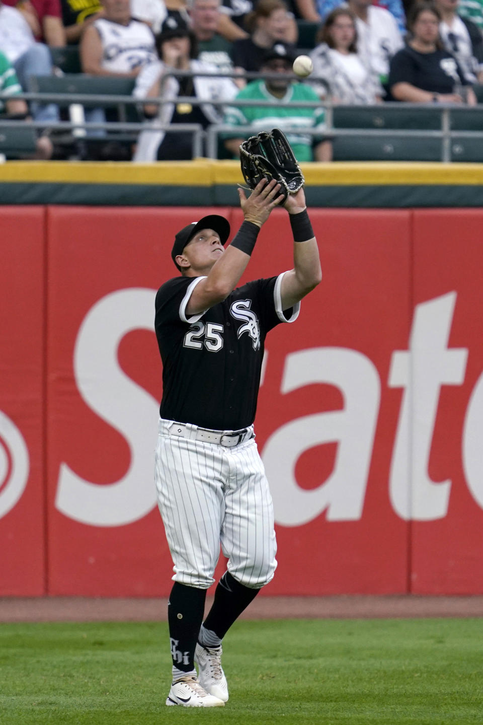 Chicago White Sox left fielder Andrew Vaughn catches a fly ball hit by Minnesota Twins' Luis Arraez during the first inning of a baseball game in Chicago, Saturday, Sept. 3, 2022. (AP Photo/Nam Y. Huh)