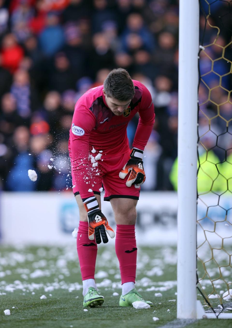 Livingston goalkeeper Max Stryjek was hit by a snowball thrown from the away fans’ section (Jeff Holmes/PA) (PA Wire)