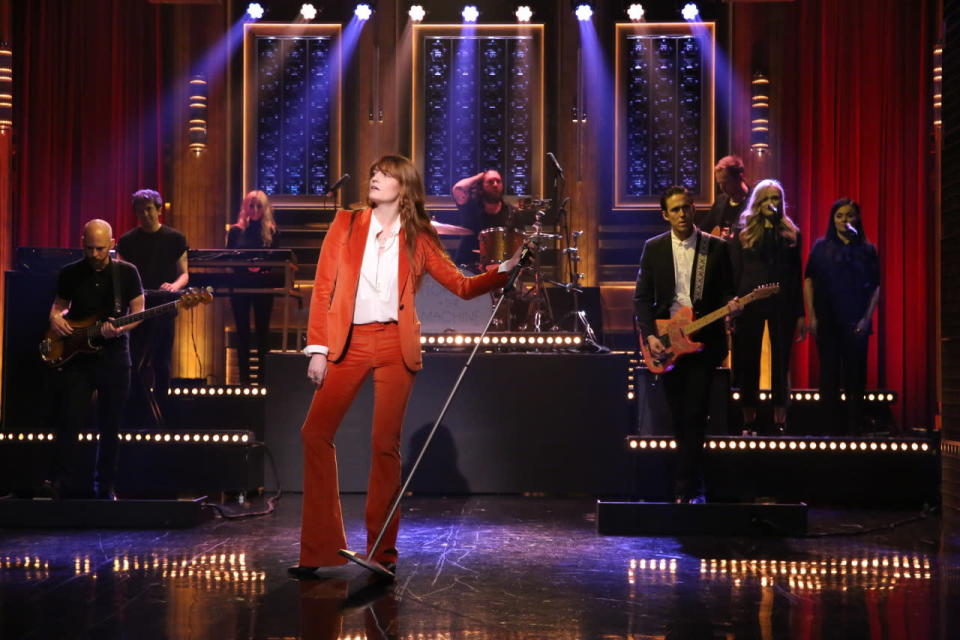 Florence Welch looking sharp in a rust-colored suit on The Tonight Show. 
