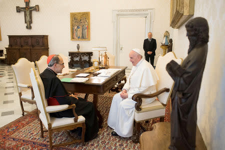 FILE PHOTO: Pope Francis receives Cardinal Philippe Barbarin, Archbishop of Lyon, at the Vatican, March 18, 2019. Vatican Media/Handout via REUTERS