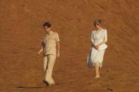 <p>Prince Charles leads Princess Diana around Ayers Rock during a royal photo-op.<br></p>