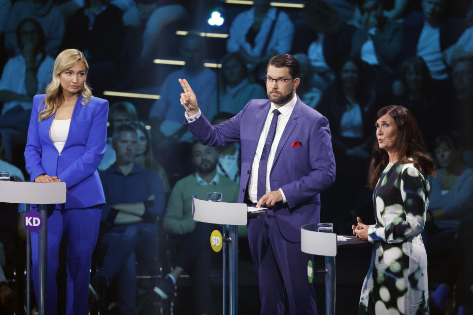 Ebba Busch, leader of the Christian Democrats, left, Jimmie Akesson, leader of the Sweden Democrats and Marta Stenevi spokes person for the Green Party, right, take part in a political debate broadcasted on TV4 from Eskilstuna, Sweden, Thursday Sept. 8, 2022. General elections will be held in Sweden on September 11. (Christine Olsson/TT via AP)