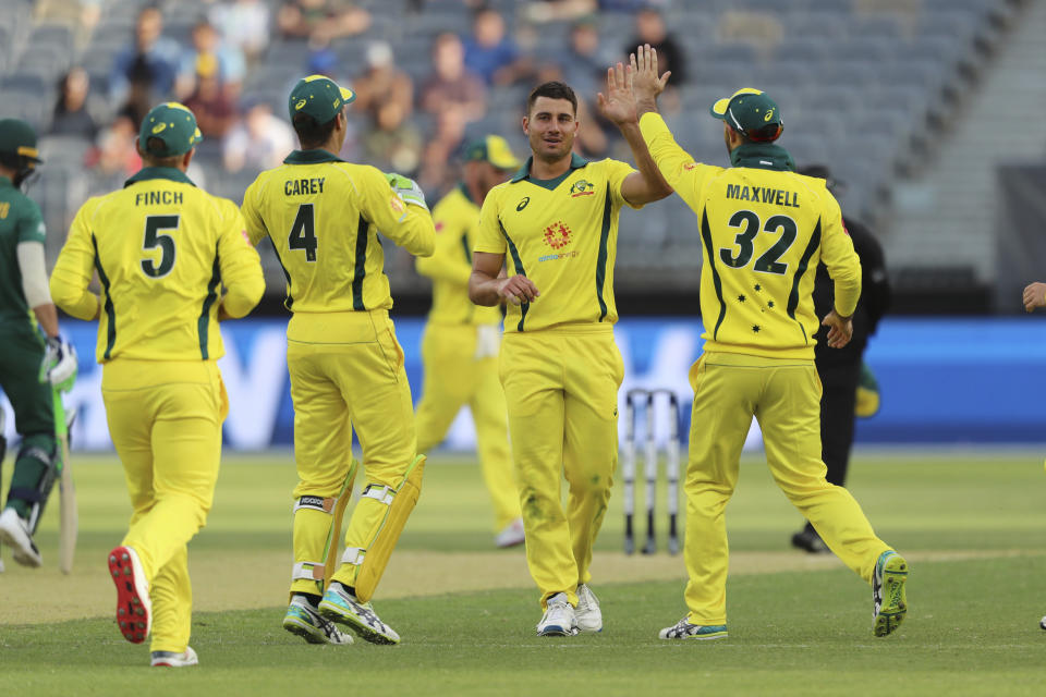 Australia's Marcus Stoinis (center) celebrates after taking the wicket of South Africa's Aiden Markram during their one-day international cricket match in Perth, Sunday, Nov. 4, 2018. (AP Photo/Trevor Collens)