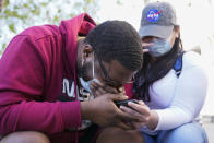 London Williams, 31, of Harrisburg, Pa., bursts into tears on Tuesday, April 20, 2021, in Washington, after hearing that former Minneapolis police Officer Derek Chauvin was convicted of murder and manslaughter in the death of George Floyd. (AP Photo/Jacquelyn Martin)