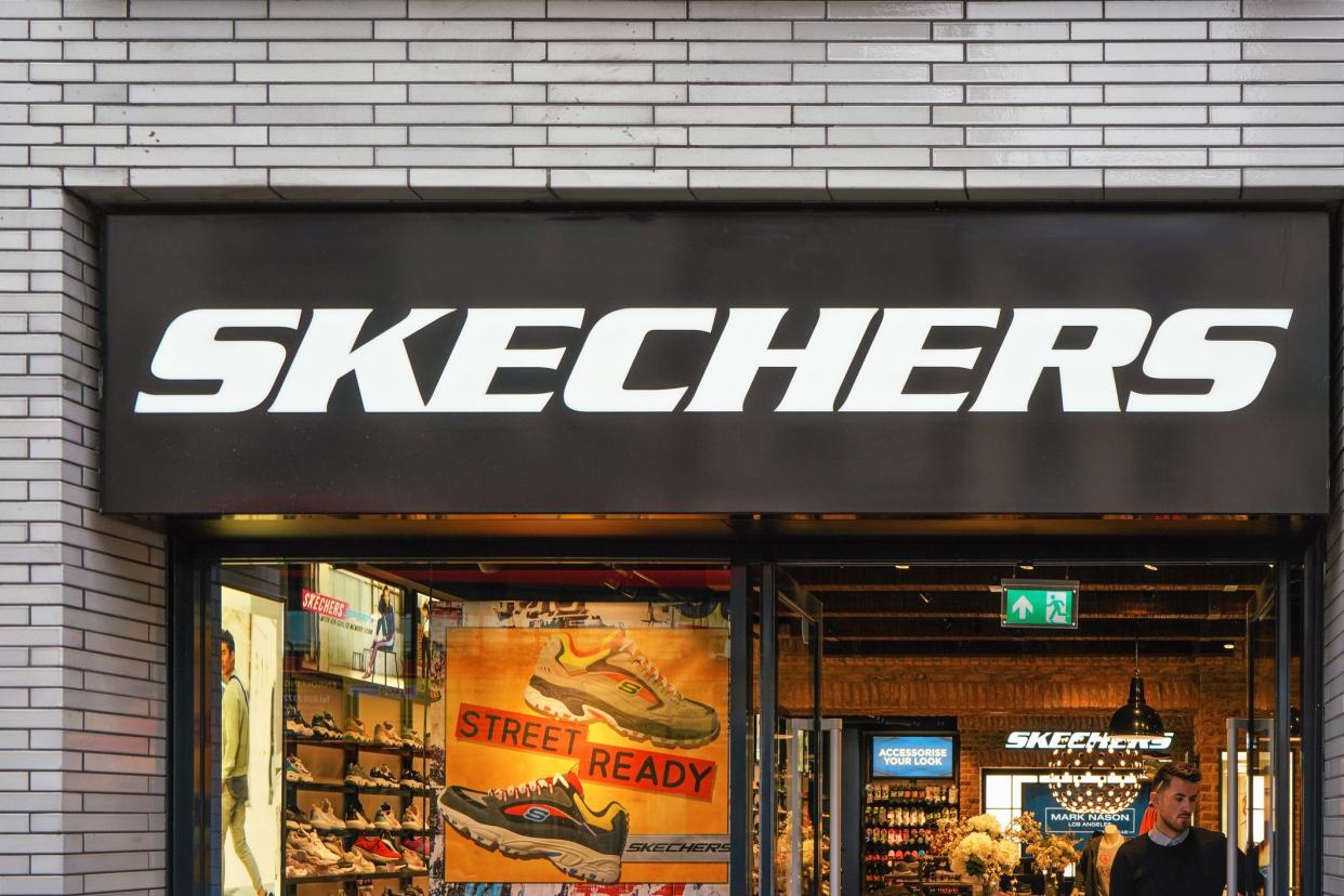 London, United Kingdom - February 01, 2019: White letters logo on Skechers shop at their Oxford Street branch. It is American company selling mostly footwear