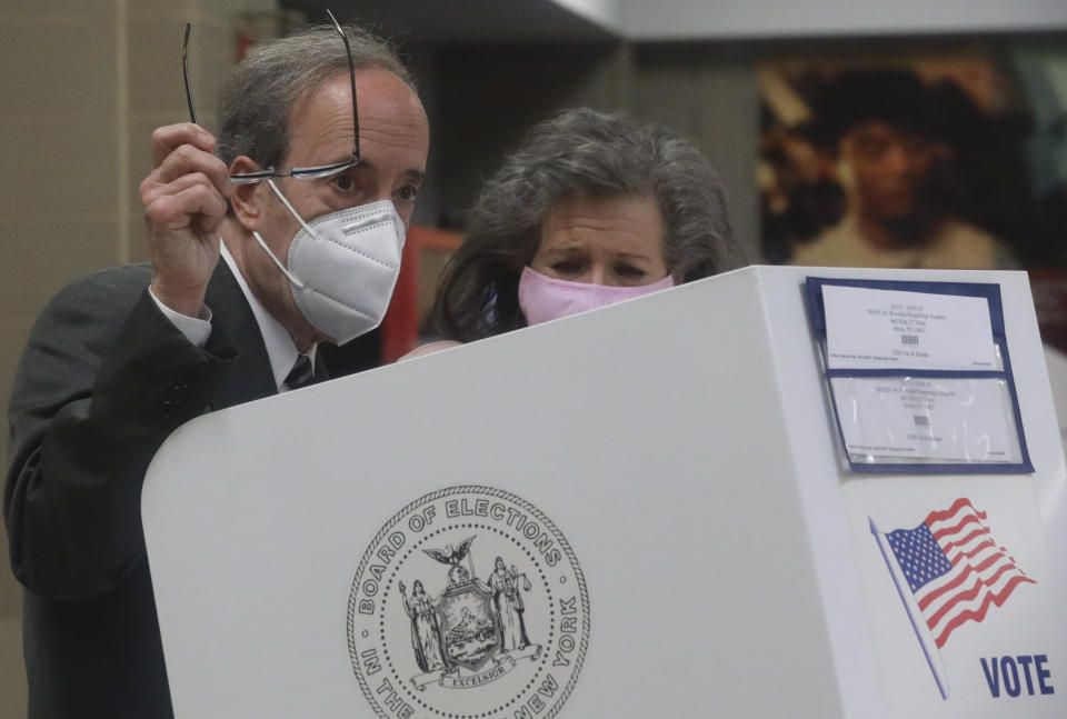 Pat Ennis Engel, right, stands with her husband Congressman Eliot Engel as he prepares to cast votes for primary elections Tuesday June 23, 2020, in the Riverdale section of New York. Engel is being challenged by former middle school principal Jamaal Bowman. (AP Photo/Bebeto Matthews)