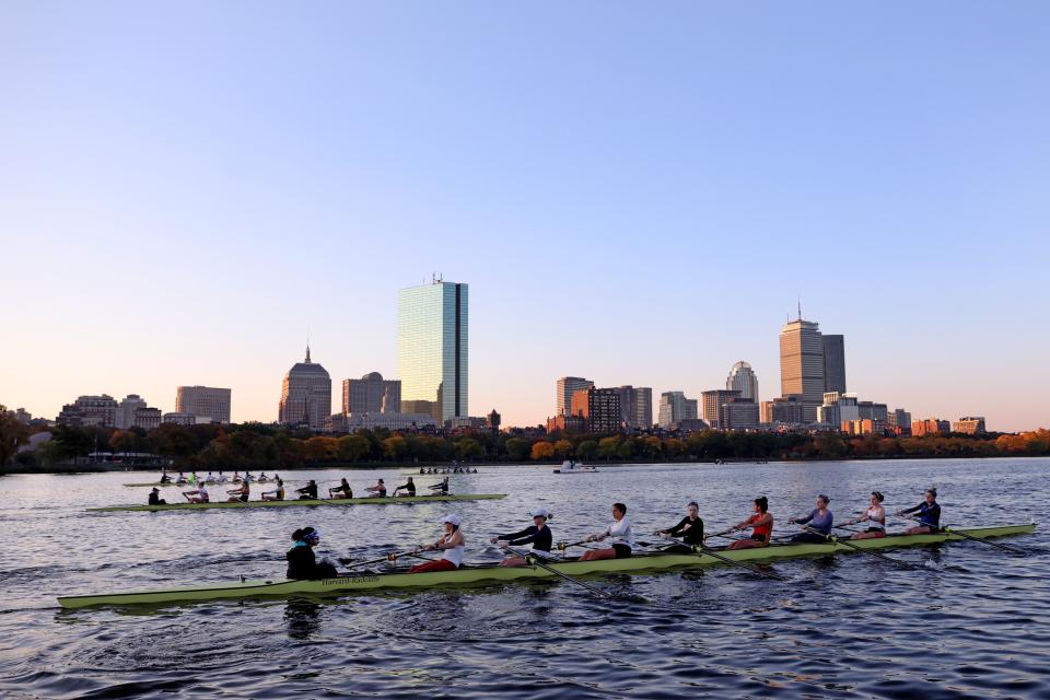 CAMBRIDGE, MASSACHUSETTS - OCTOBER 12:  Members of the Harvard-Radcliffe Women's Heavyweight Crew team train against the Boston city skyline on the Charles River in preparation for the Head of the Charles Regatta on October 12, 2022 in Cambridge, Massachusetts. (Photo by Maddie Meyer/Getty Images)