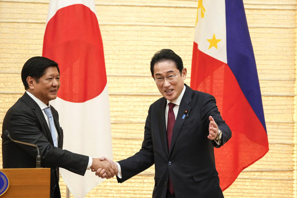 Philippine President Ferdinand Marcos Jr., left, and Japanese Prime Minister Fumio Kishida conclude their joint press remarks after their talks at the prime minister's official residence in Tokyo, Thursday, Feb. 9, 2023. (Kimimasa Mayama/Pool Photo via AP)