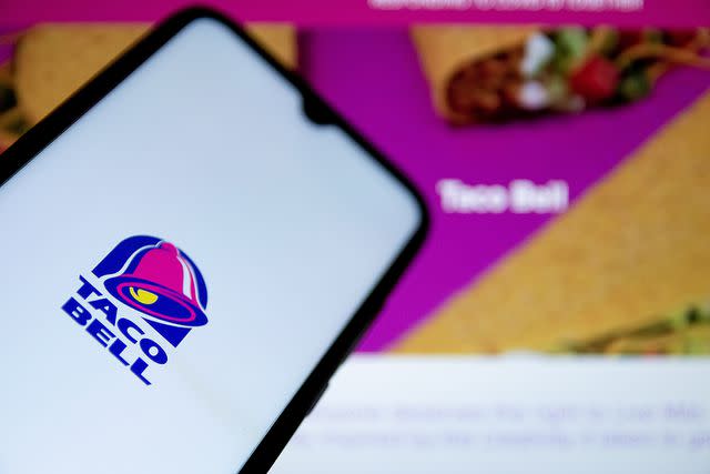 <p>Nikolas Joao Kokovlis/SOPA Images/LightRocket via Getty Images</p> Taco Bell logo on smartphone