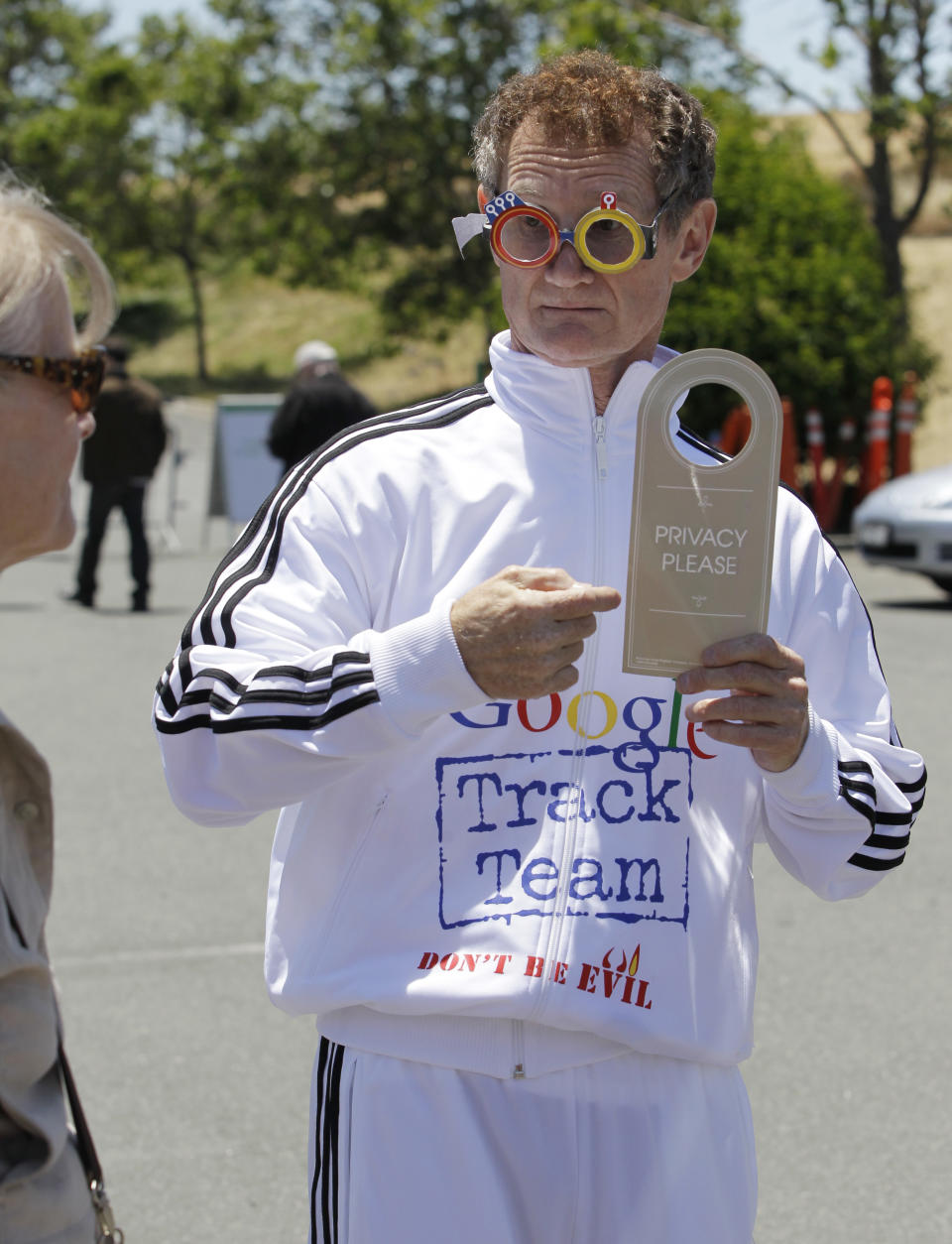 Consumer Watchdog demonstrator Derek Loughran protests in front of a Google shareholder outside of Google headquarters in Mountain View, Calif., Thurday, June 21, 2012 before the Google shareholders meeting. Protestors demonstrated to help raise awareness of Google's online tracking policy. They are calling for legislation for "Do Not Track" mechanism urged by the FTC. They are protesting information from being gathered by Google without permission. (AP Photo/Paul Sakuma)