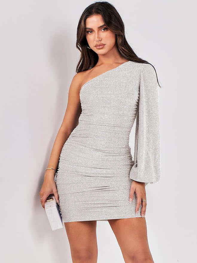 model in one-shoulder silver mini dress