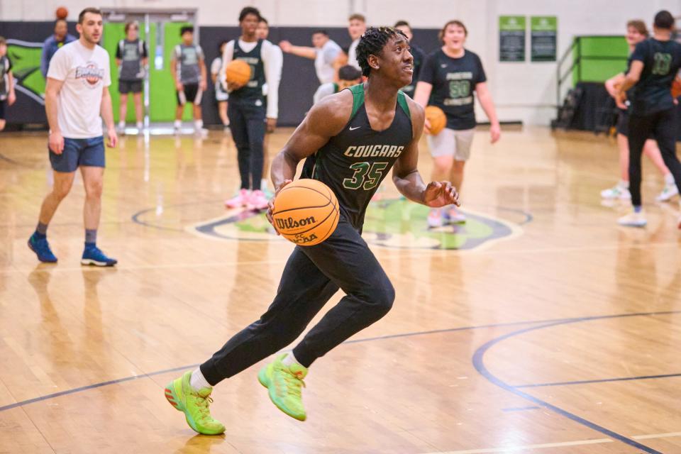 Jan 23, 2023; Phoenix, AZ, USA; Phoenix Christian Cougars point guard Tommy Randolph drives for the basket during practice at the Phoenix Christian High School gym on Monday, Jan. 23, 2023. Mandatory Credit: Alex Gould/The Republic