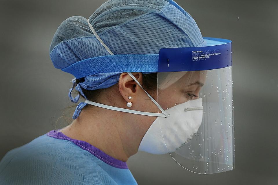 PENNSYLVANIA: Nurse Jamie Huot, a Philadelphia Medical Reserve Corps volunteer, works at a coronavirus testing site in South Philadelphia on March 20.